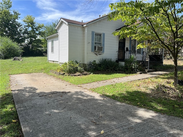 view of home's exterior with a yard