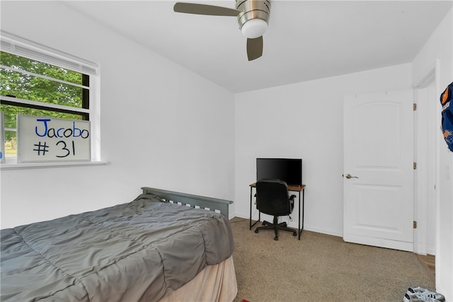 bedroom with ceiling fan and carpet floors