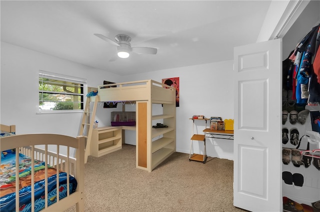 bedroom with light carpet and ceiling fan