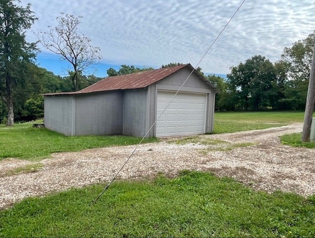 detached garage featuring driveway