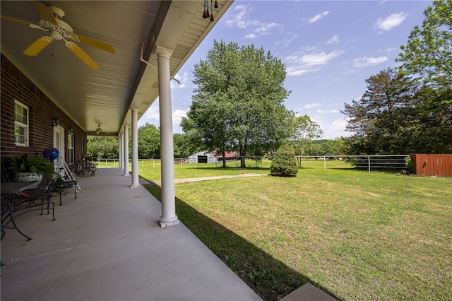 view of yard with a patio and ceiling fan