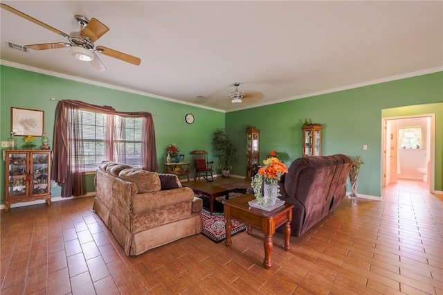 living room featuring hardwood / wood-style floors, ceiling fan, and ornamental molding