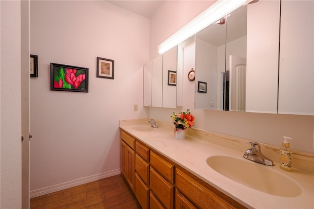 bathroom featuring vanity and hardwood / wood-style flooring