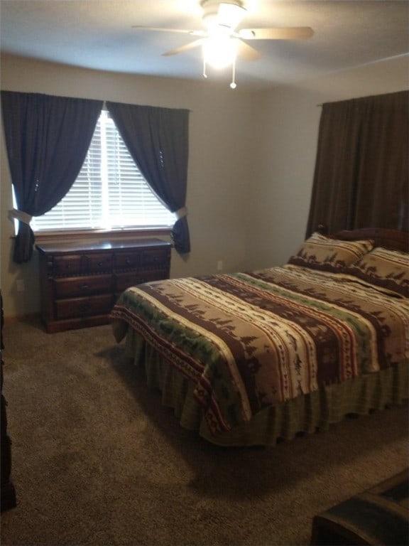 carpeted bedroom featuring ceiling fan