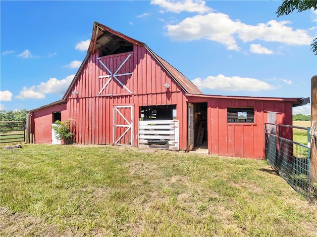 view of outbuilding featuring a yard