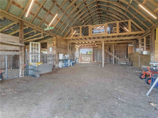 miscellaneous room featuring high vaulted ceiling