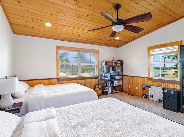 carpeted bedroom with ceiling fan, wood ceiling, crown molding, and lofted ceiling