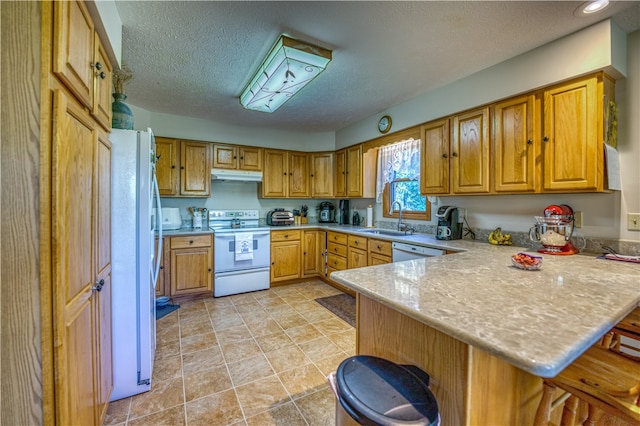 kitchen featuring a kitchen breakfast bar, white appliances, kitchen peninsula, a textured ceiling, and sink