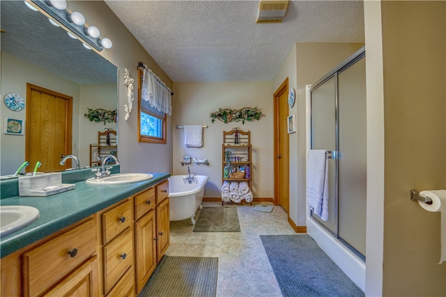 bathroom featuring a textured ceiling, shower with separate bathtub, and vanity