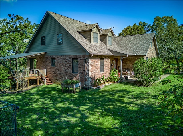 back of property featuring a lawn