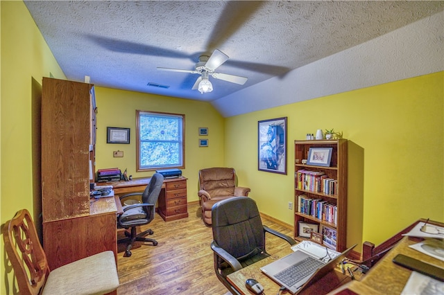 office area with ceiling fan, a textured ceiling, light wood-type flooring, and lofted ceiling