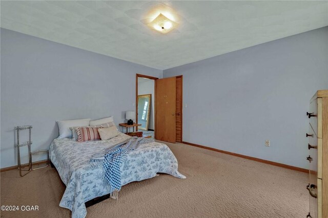 bedroom with light colored carpet