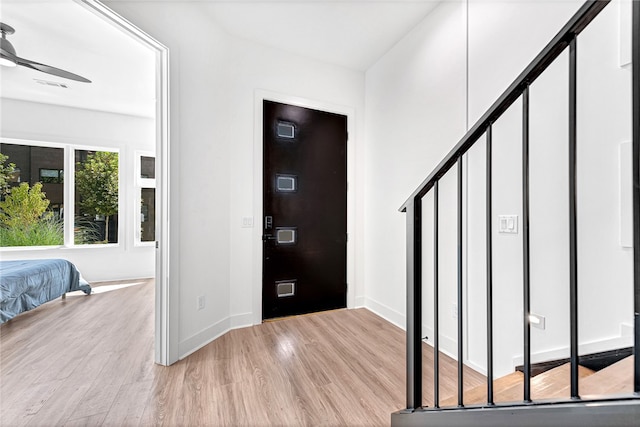 entryway featuring ceiling fan and light hardwood / wood-style floors