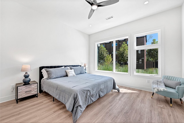 bedroom featuring light hardwood / wood-style flooring and ceiling fan