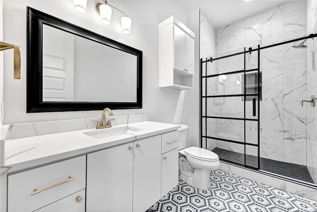 bathroom featuring tile patterned flooring, walk in shower, toilet, and vanity