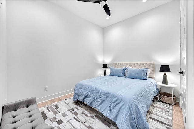 bedroom with ceiling fan and light wood-type flooring