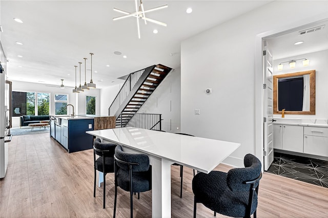 dining room with light hardwood / wood-style flooring