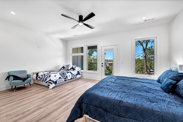 bedroom featuring ceiling fan, access to exterior, and wood-type flooring