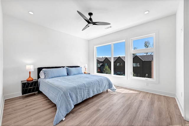 bedroom featuring ceiling fan and light hardwood / wood-style floors