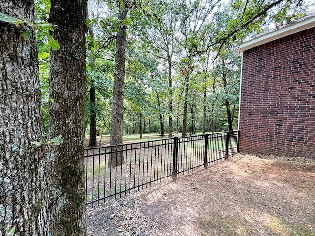 view of gate with fence