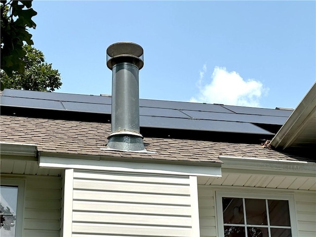 details featuring a shingled roof