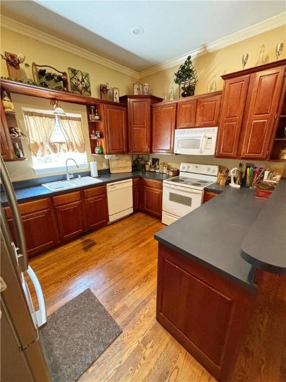 kitchen with light wood-style flooring, white appliances, a sink, open shelves, and dark countertops