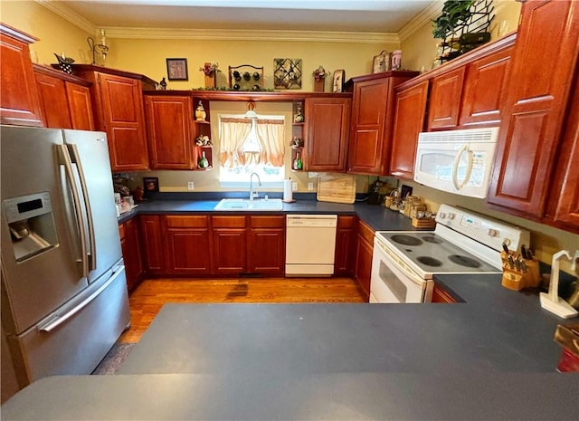 kitchen with open shelves, ornamental molding, a sink, wood finished floors, and white appliances