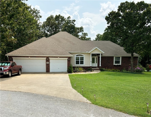 ranch-style home with a garage and a front yard