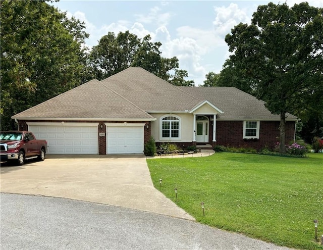 ranch-style home featuring a garage, driveway, a shingled roof, a front yard, and brick siding