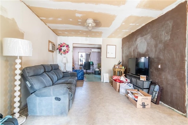 living room featuring a wall mounted AC and ceiling fan