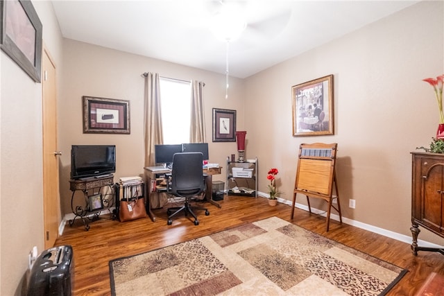 office featuring hardwood / wood-style floors and ceiling fan