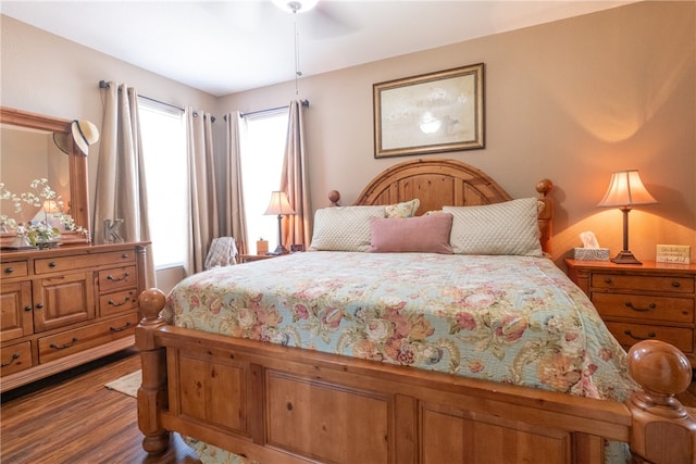 bedroom featuring hardwood / wood-style floors and ceiling fan