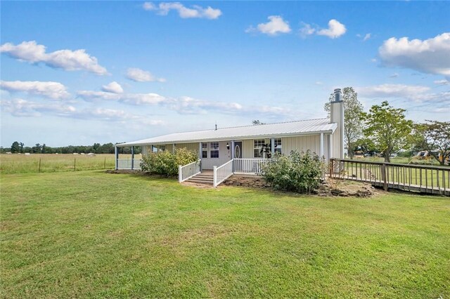 57110 59th Hwy, Kansas, OK 74338 - back of house with covered porch and a lawn