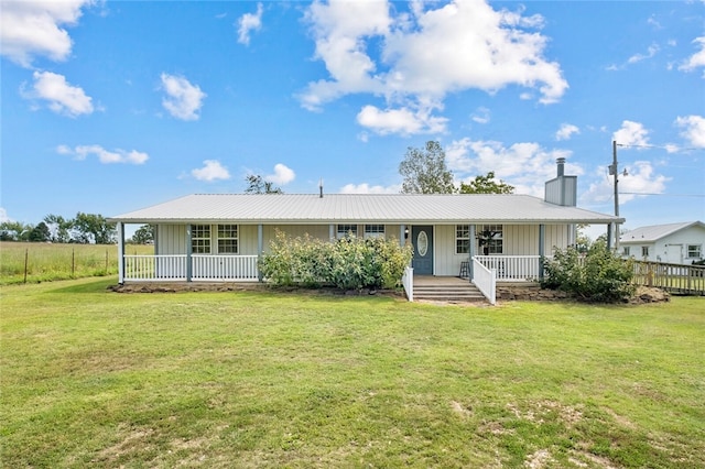 back of house featuring a porch and a lawn