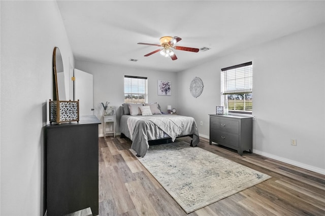 bedroom featuring ceiling fan and light hardwood / wood-style floors