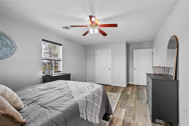 bedroom featuring ceiling fan and hardwood / wood-style floors