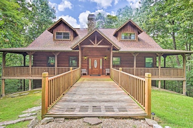 view of front of house with a front yard and french doors