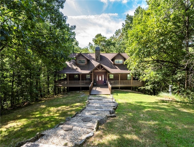 view of front of property with a front lawn and a deck