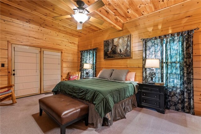 bedroom featuring wood ceiling, carpet flooring, ceiling fan, and wood walls