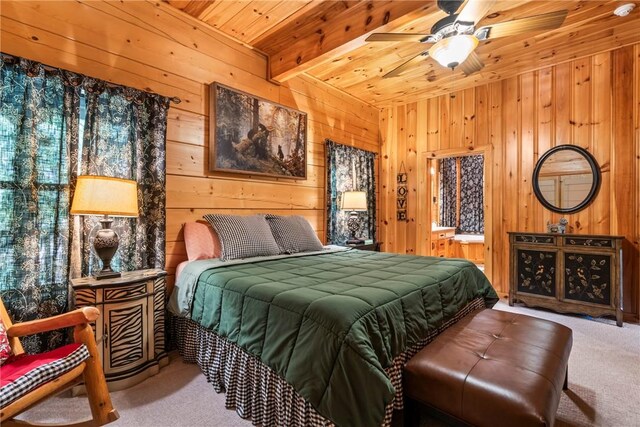 bedroom with light colored carpet, wood walls, multiple windows, and wooden ceiling