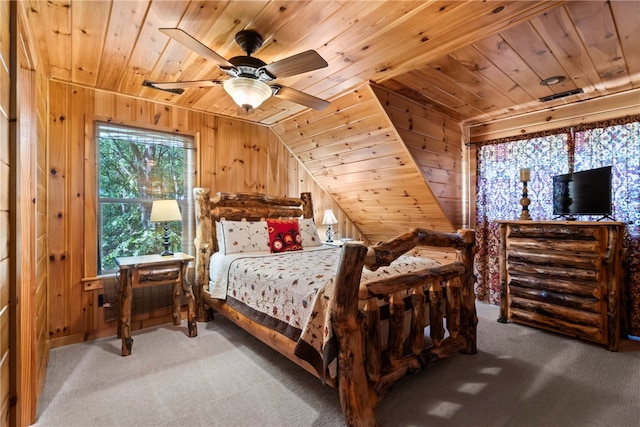 bedroom with wood walls, wood ceiling, carpet, and ceiling fan