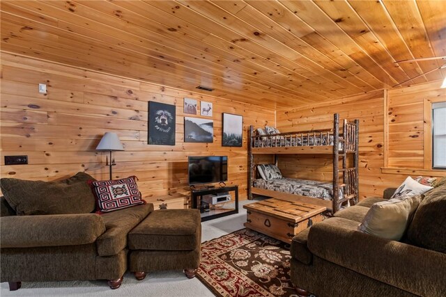 carpeted living room featuring wooden ceiling and wooden walls