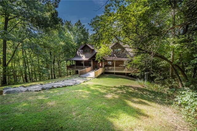 view of yard featuring a wooden deck