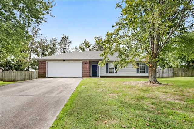 ranch-style house with a garage and a front yard