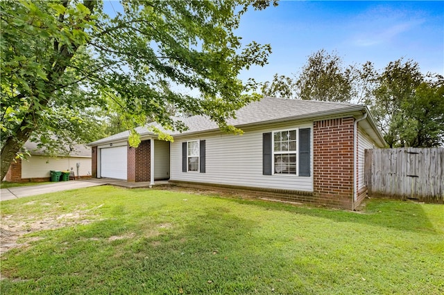 ranch-style house featuring a garage and a front lawn