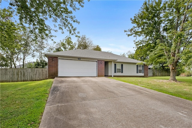 ranch-style home featuring a front lawn and a garage