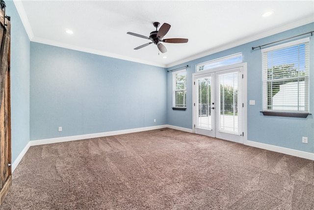 unfurnished room with crown molding, ceiling fan, carpet, and french doors