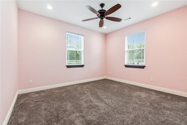 carpeted empty room featuring ceiling fan