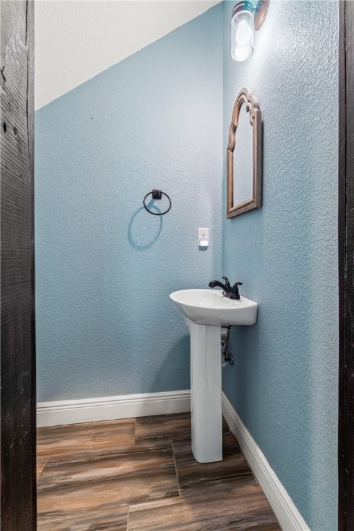 bathroom featuring hardwood / wood-style flooring