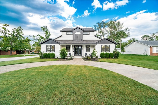 modern inspired farmhouse featuring a front lawn